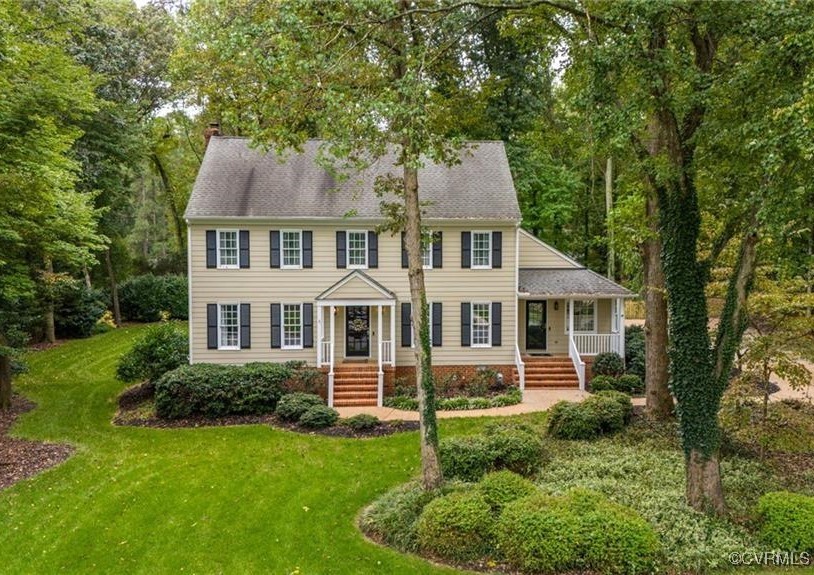 10219 Sioux Road Richmond, VA 23235 - Photo 1 of 48 Colonial home featuring a front lawn and covered p