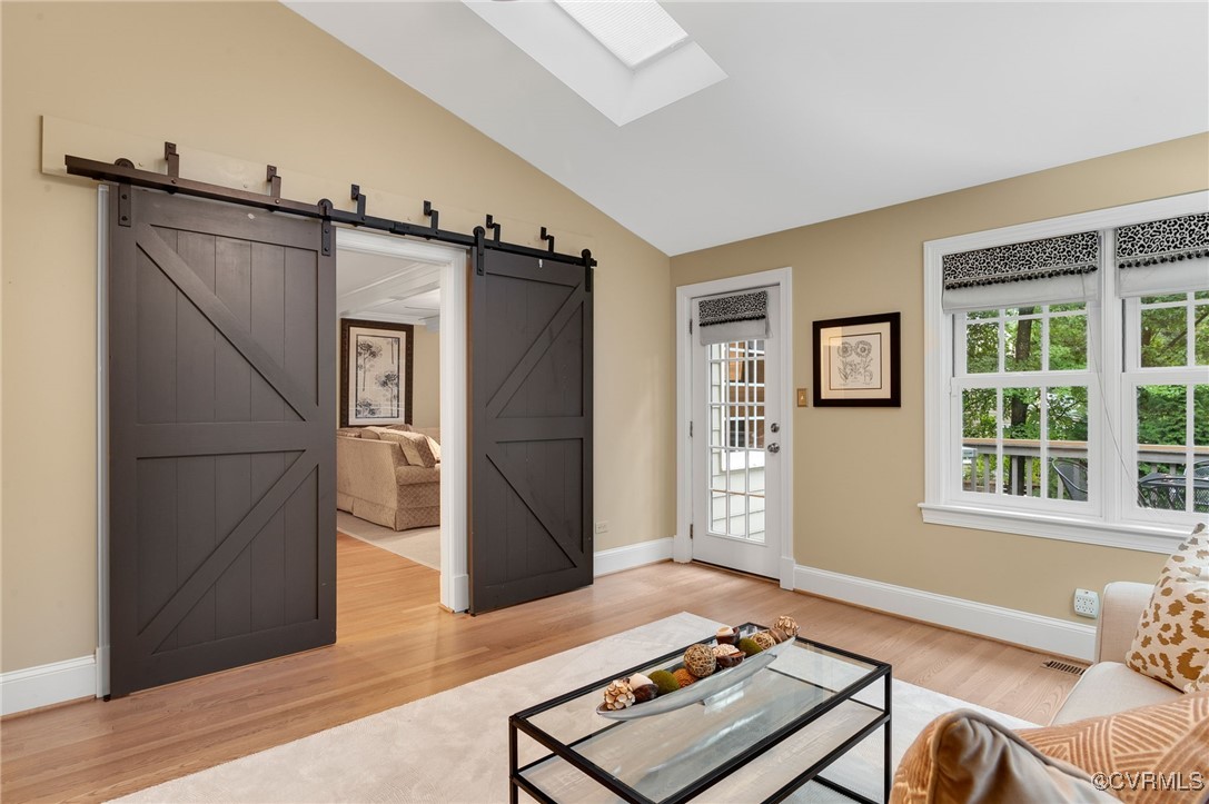 10219 Sioux Road Richmond, VA 23235 - Photo 24 of 48 Living room with wood-type flooring, vaulted ceili