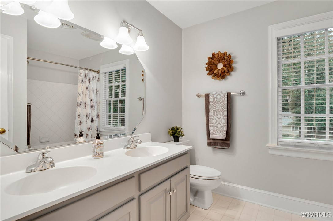 10219 Sioux Road Richmond, VA 23235 - Photo 28 of 48 Bathroom featuring curtained shower, tile patterne