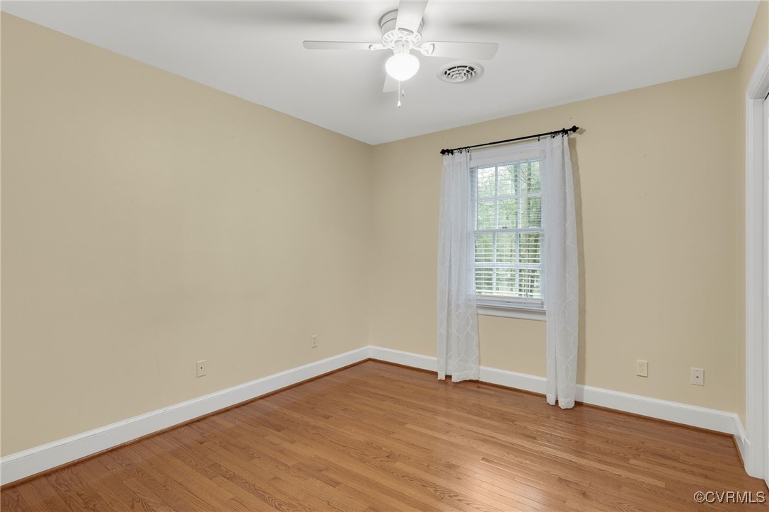 10219 Sioux Road Richmond, VA 23235 - Photo 30 of 48 Spare room featuring ceiling fan and light hardwoo