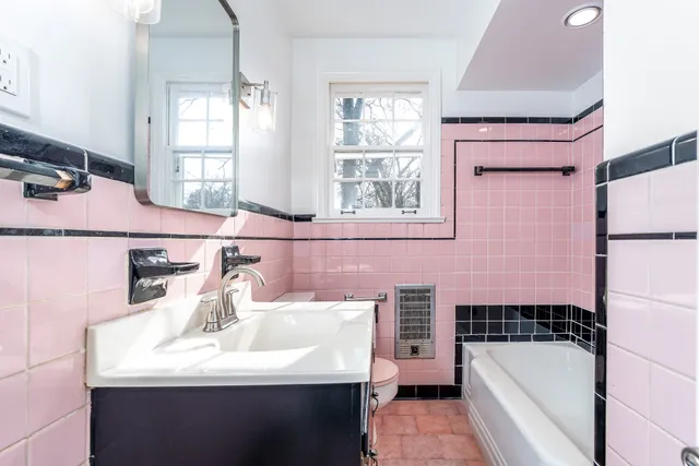 a bathroom with a sink a bathtub and a shower