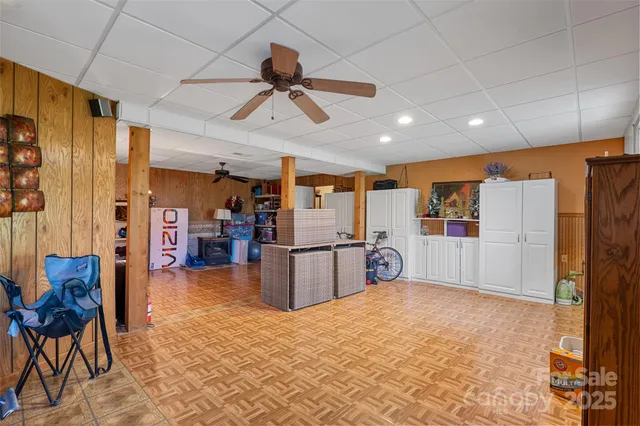 a kitchen with stainless steel appliances kitchen island granite countertop furniture and a refrigerator