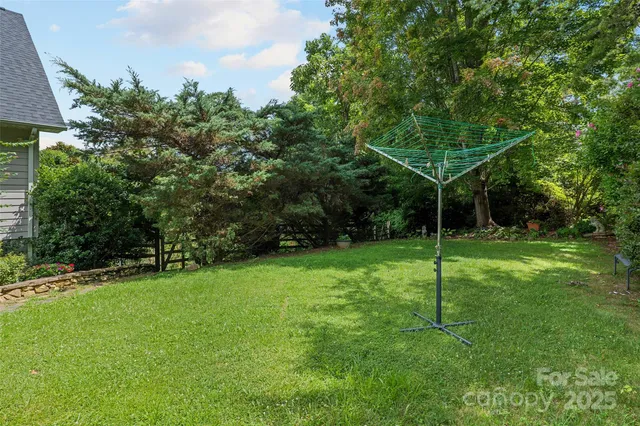 a view of a wooden deck and a backyard