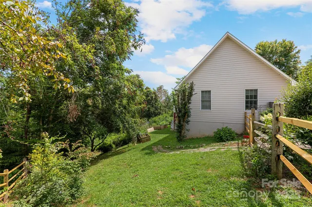 a view of a two chairs and a table in a yard