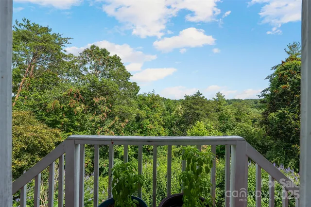 an aerial view of a house with swimming pool and garden