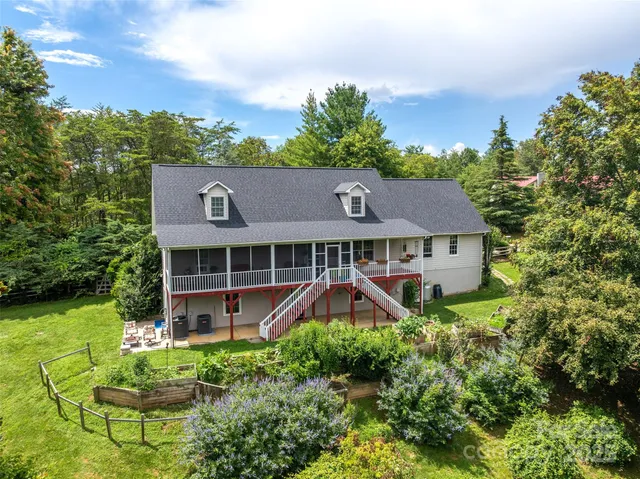 a front view of a house with lots of garden