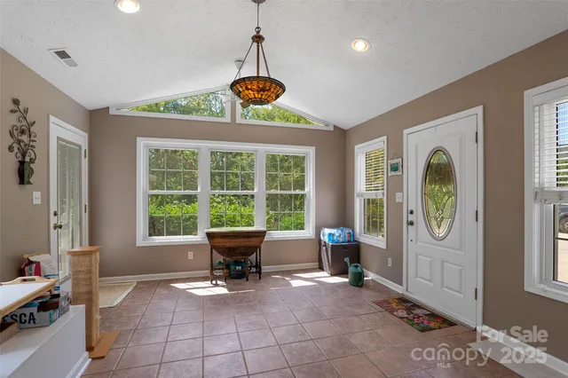 a view of a livingroom with furniture window and outside view
