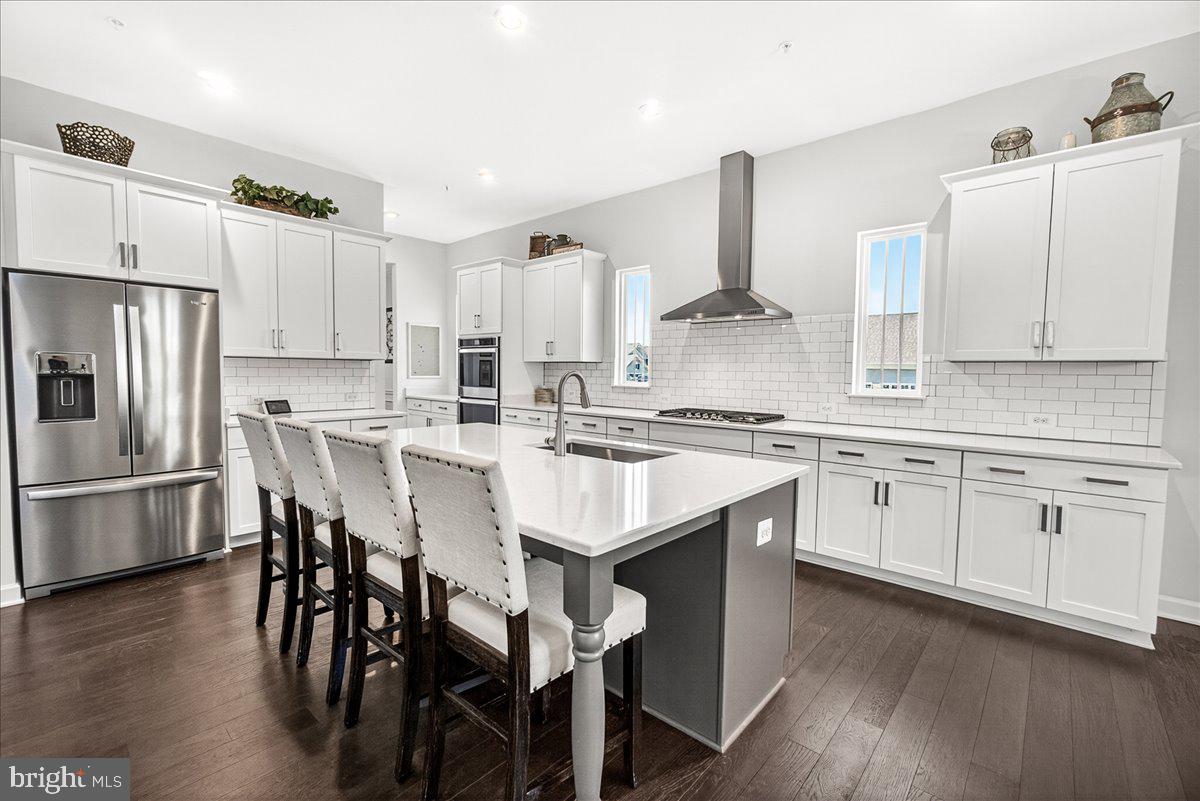 3633 Moline Court Monrovia, MD 21770 - Photo 27 of 82 a kitchen with stainless steel appliances granite countertop a white cabinets and a stove top oven