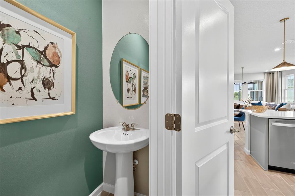 8830 Ginko Run Parrish, FL 34219 - Photo 16 of 29 a bathroom with a sink and a mirror