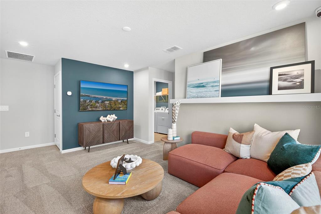 8830 Ginko Run Parrish, FL 34219 - Photo 18 of 29 a living room with furniture and a table