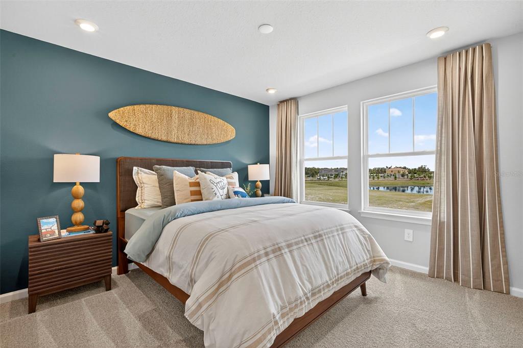 8830 Ginko Run Parrish, FL 34219 - Photo 27 of 29 a bedroom with a bed and a window