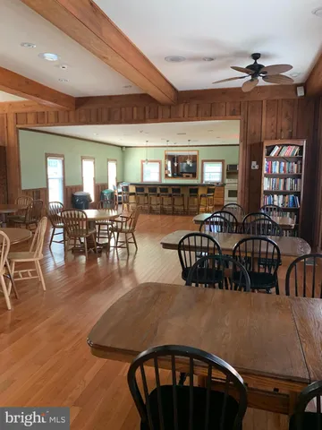 a view of a lake with a table and chairs