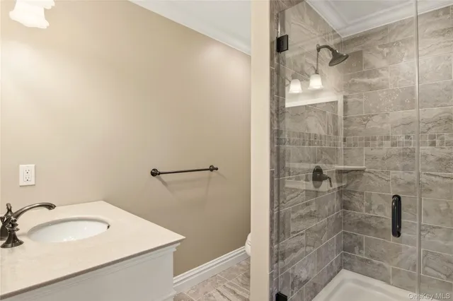 a bathroom with a sink and shower