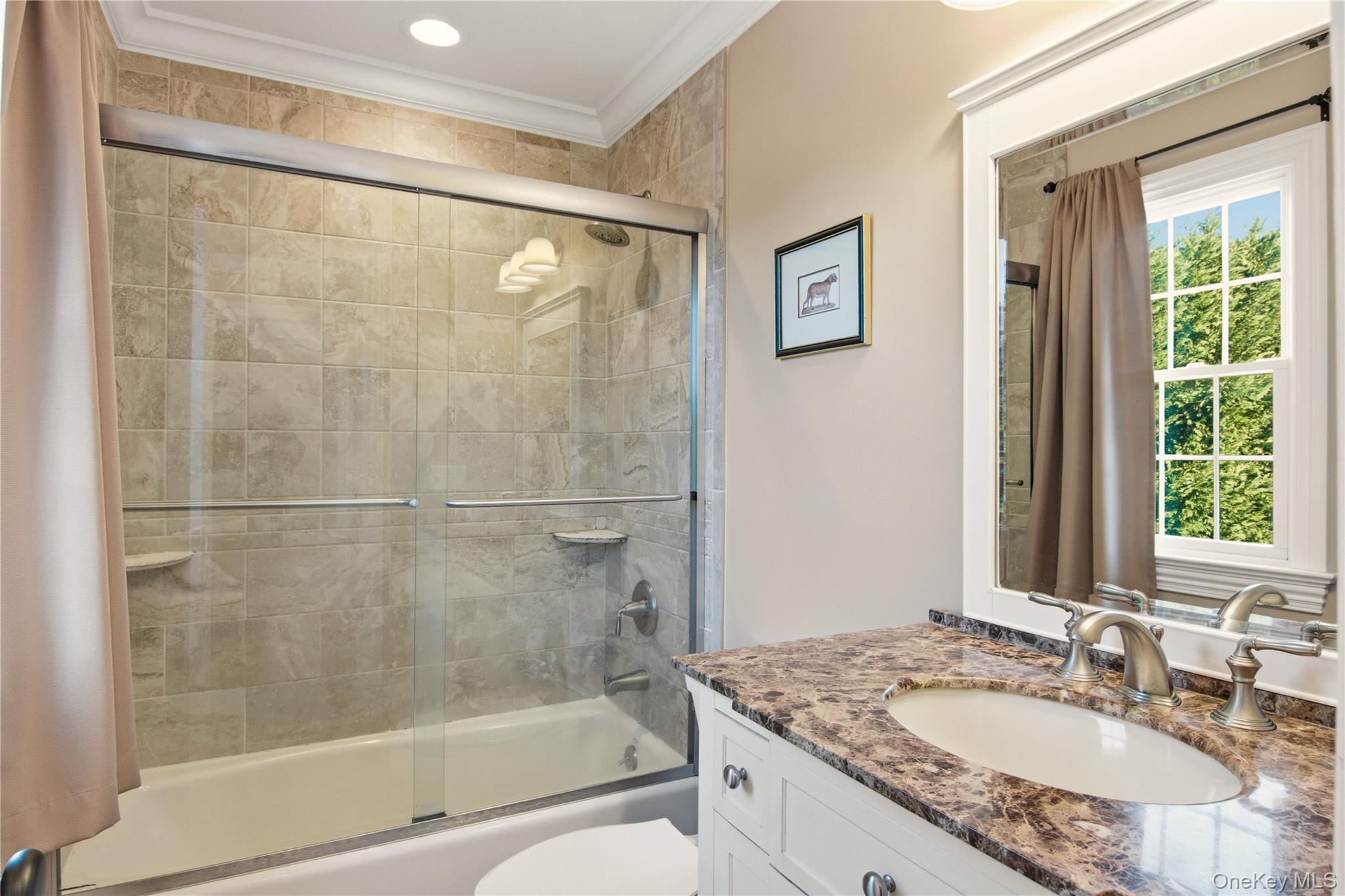 69 Old Depot Road Quogue, NY 11959 - Photo 25 of 40 Full bathroom with vanity, enclosed tub / shower combo, and crown molding