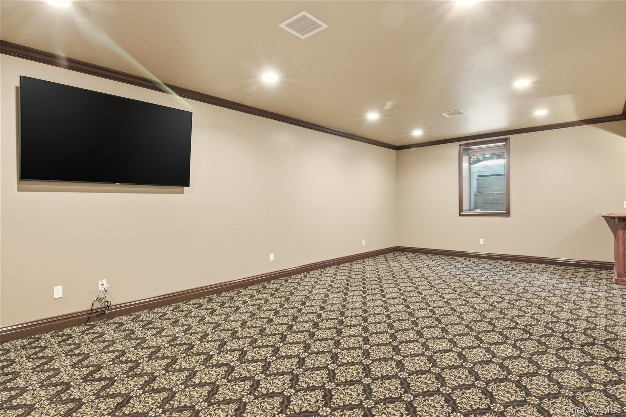 69 Old Depot Road Quogue, NY 11959 - Photo 35 of 40 Carpeted spare room featuring crown molding and recessed lighting