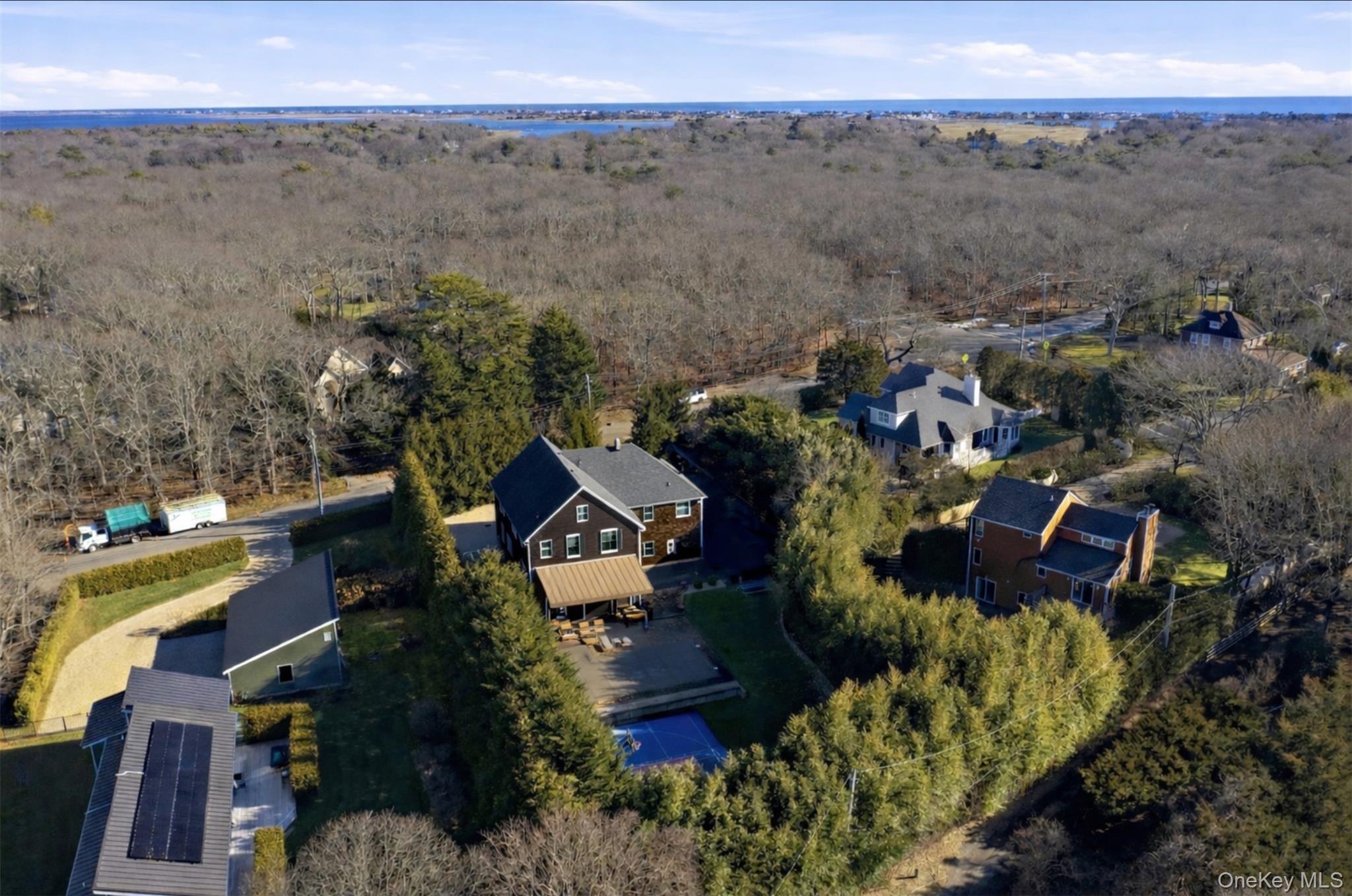 69 Old Depot Road Quogue, NY 11959 - Photo 44 of 44 an aerial view of a house with a garden