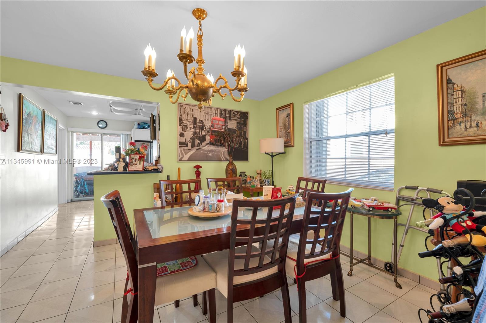 436 Southwest 26th Road Miami, FL 33129 - Photo 8 of 23 a view of a dining room with furniture and a chandelier
