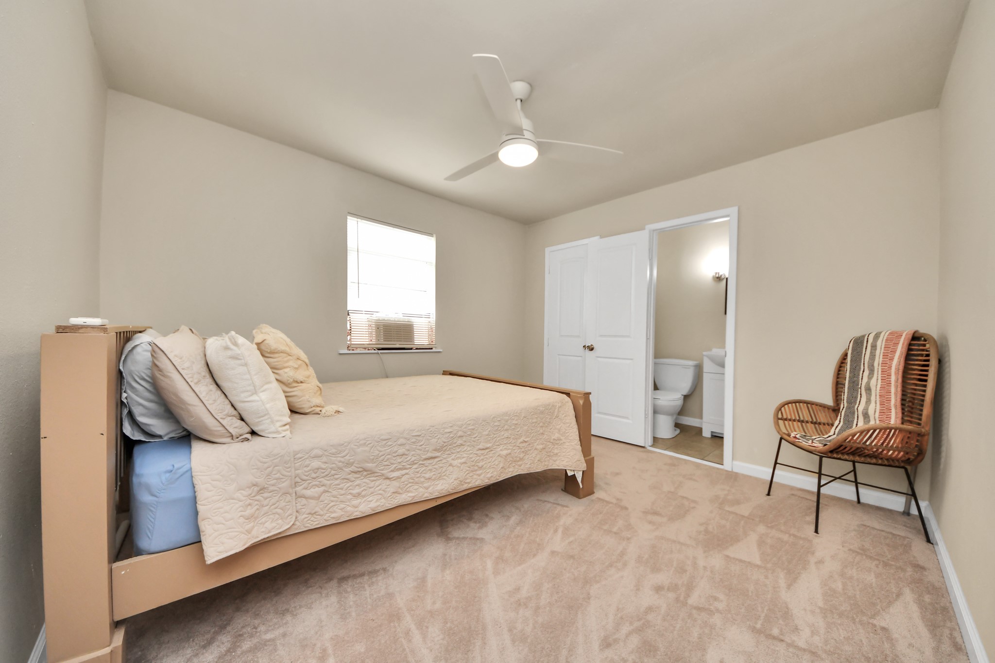 6833 Stonehaven Way Houston, TX 77085 - Photo 15 of 23 a bedroom with a bed and a chair