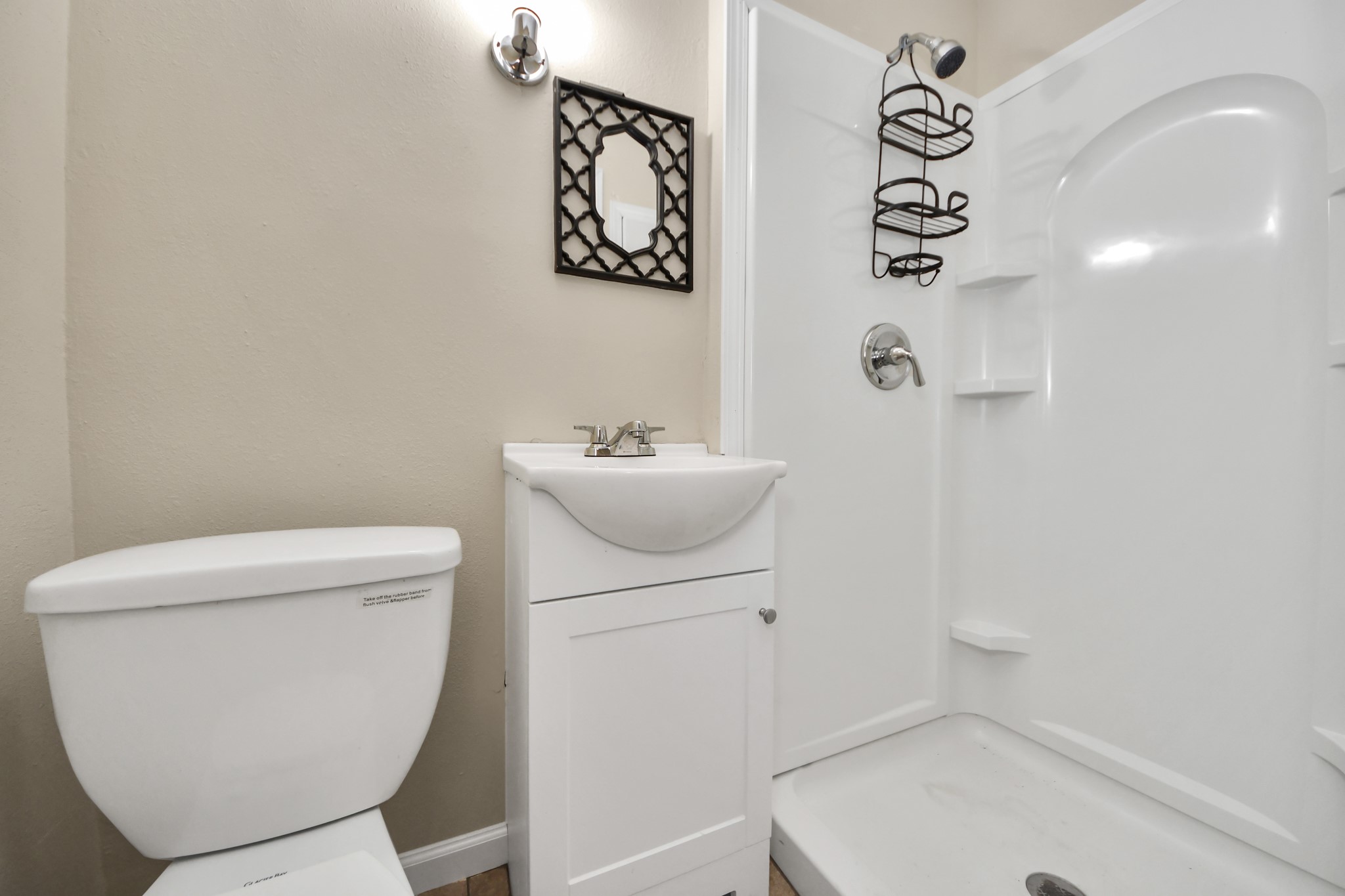 6833 Stonehaven Way Houston, TX 77085 - Photo 16 of 23 a bathroom with a toilet sink and mirror