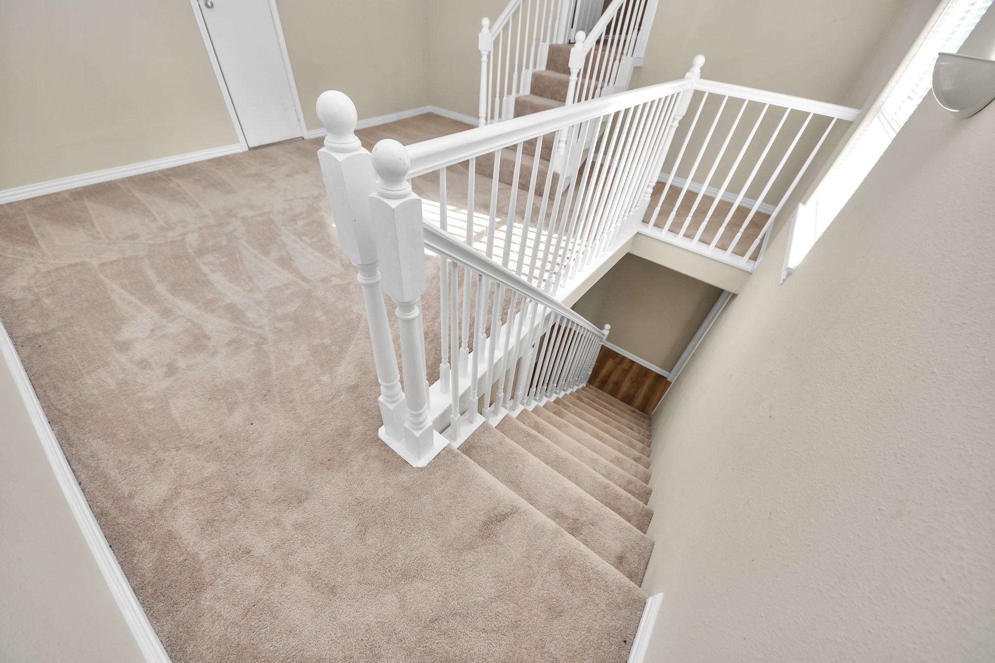 6833 Stonehaven Way Houston, TX 77085 - Photo 19 of 23 a view of staircase with white walls and a window