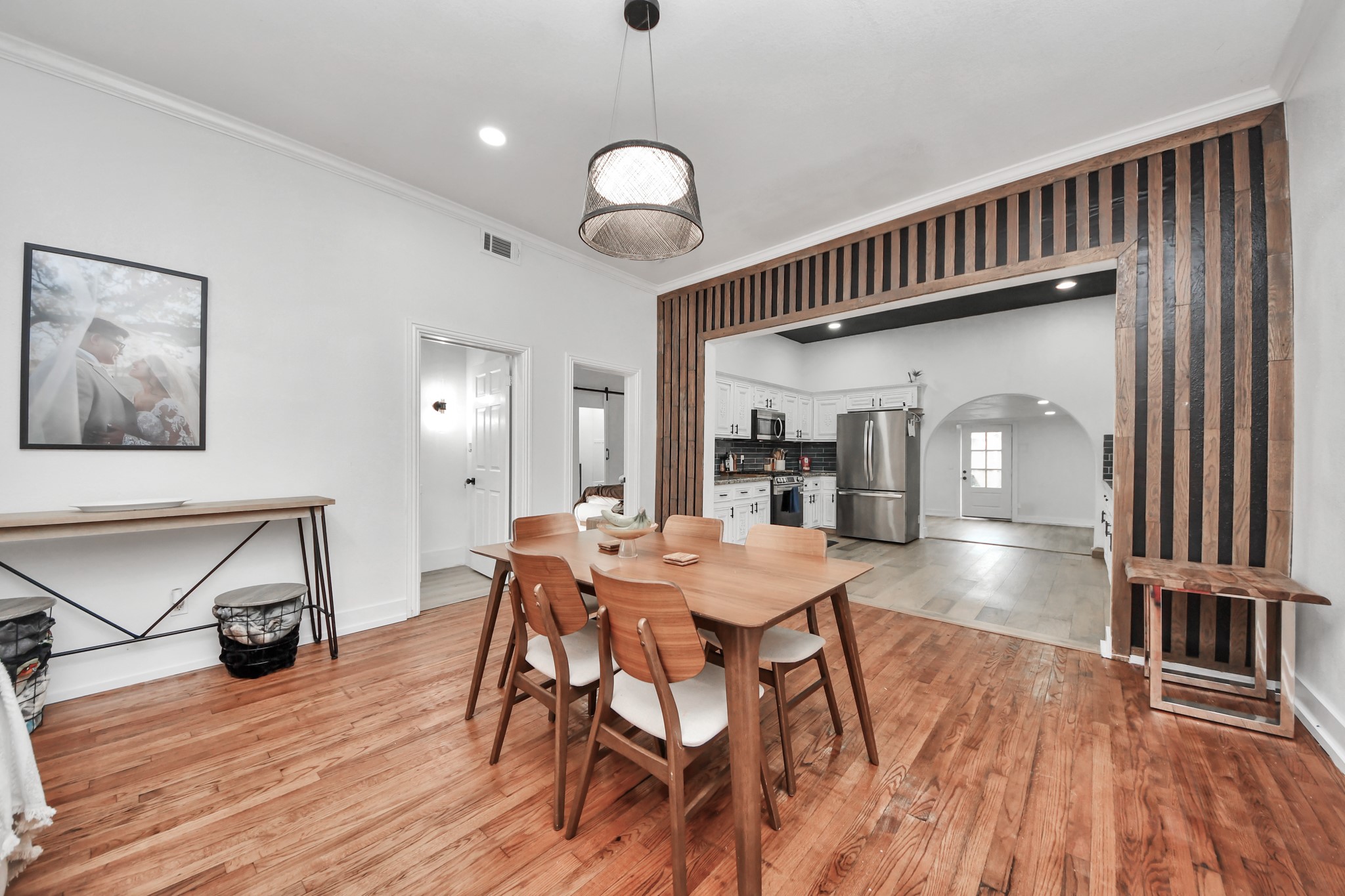 6833 Stonehaven Way Houston, TX 77085 - Photo 3 of 23 a view of a dining room with furniture and wooden floor