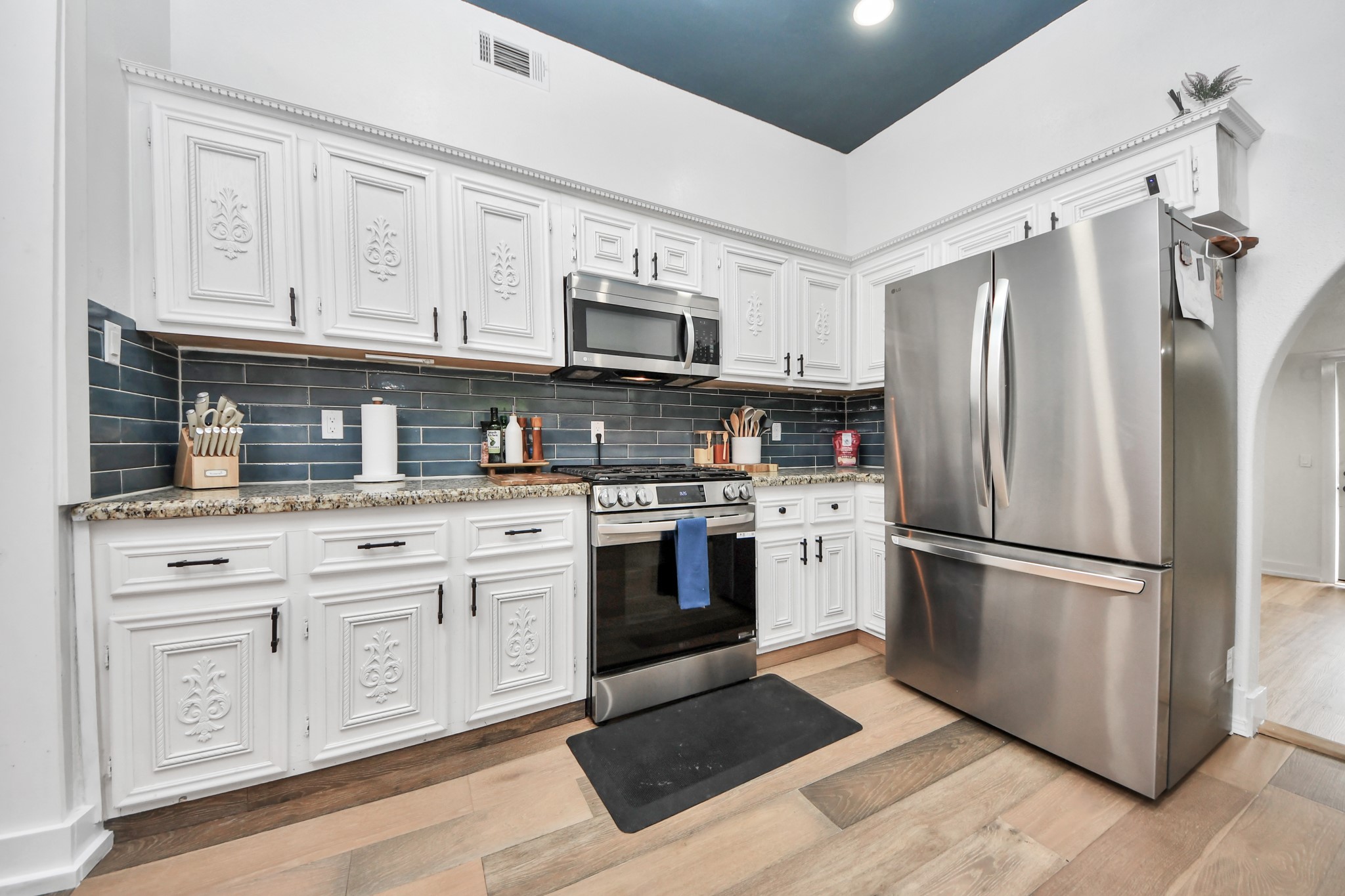 6833 Stonehaven Way Houston, TX 77085 - Photo 7 of 23 a kitchen with cabinets stainless steel appliances and a counter space