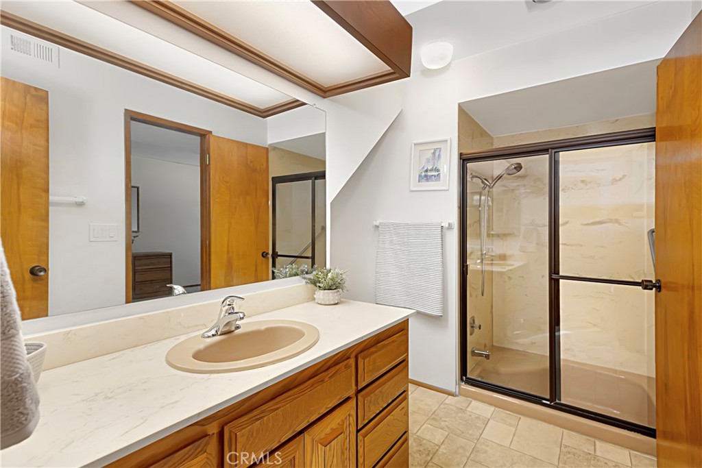 11879 Rocoso Road Lakeside, CA 92040 - Photo 19 of 25 a bathroom with a sink and a mirror