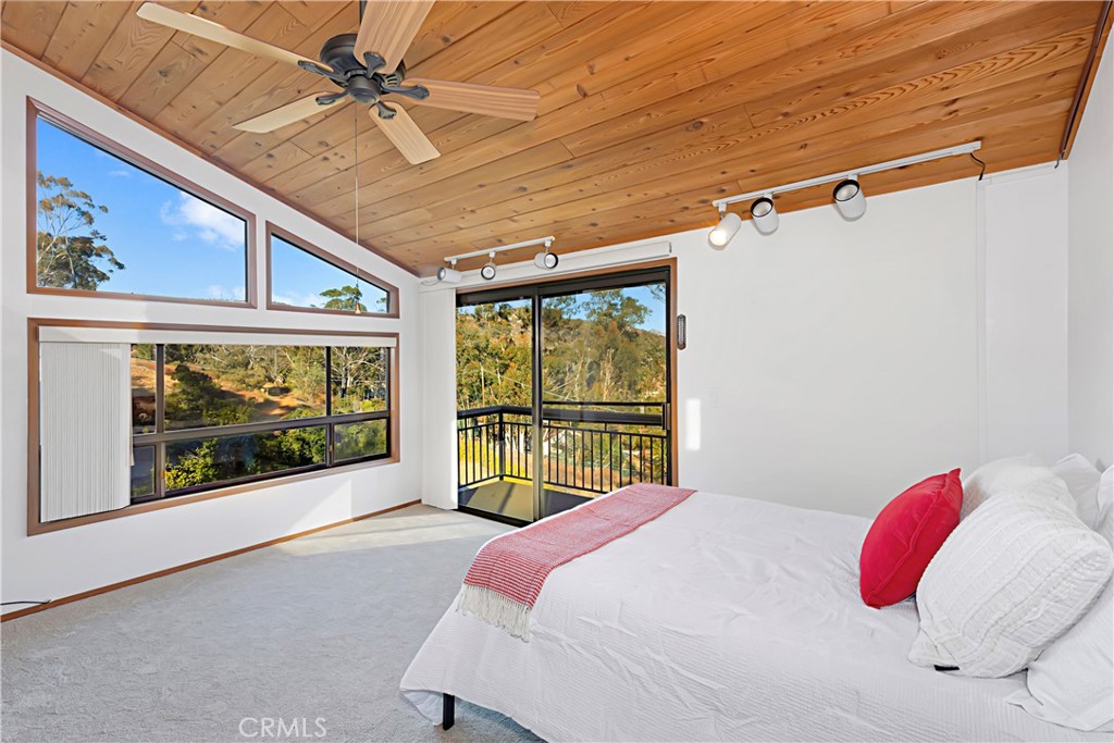 11879 Rocoso Road Lakeside, CA 92040 - Photo 20 of 25 a bedroom with a bed and window