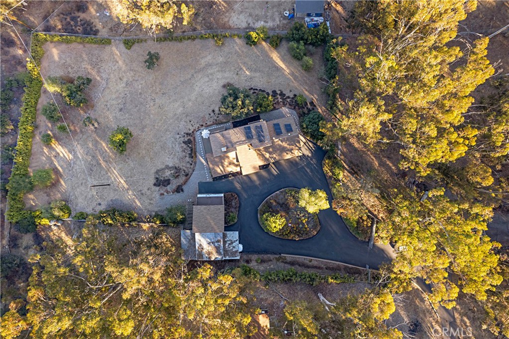 11879 Rocoso Road Lakeside, CA 92040 - Photo 2 of 25 an aerial view of a house with a yard and garden