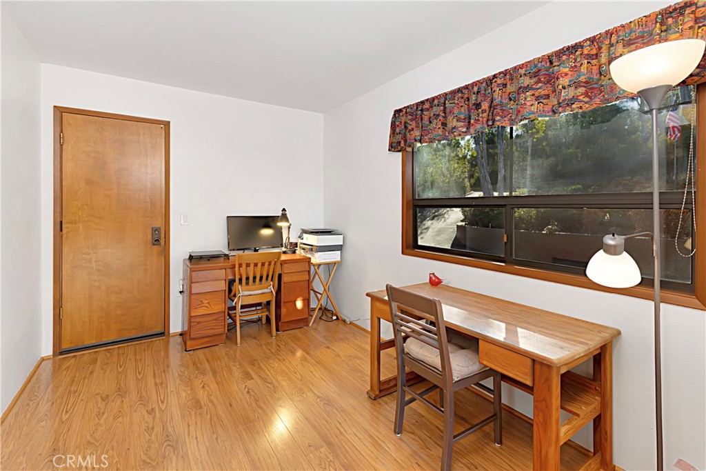 11879 Rocoso Road Lakeside, CA 92040 - Photo 21 of 25 a living room with a chair and furniture