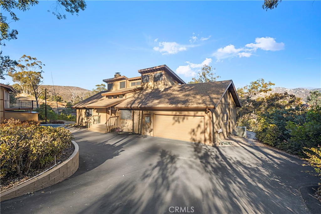 11879 Rocoso Road Lakeside, CA 92040 - Photo 4 of 25 a view of a house with a yard