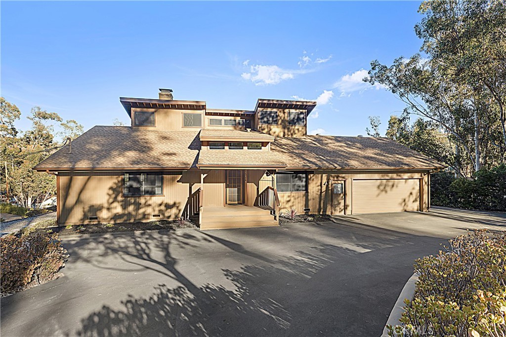 11879 Rocoso Road Lakeside, CA 92040 - Photo 6 of 25 a view of a white house with a outdoor space