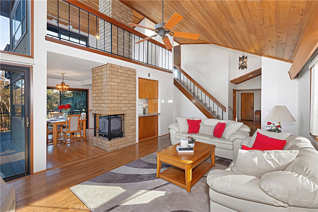 11879 Rocoso Road Lakeside, CA 92040 - Photo 7 of 25 a living room with furniture and a floor to ceiling window
