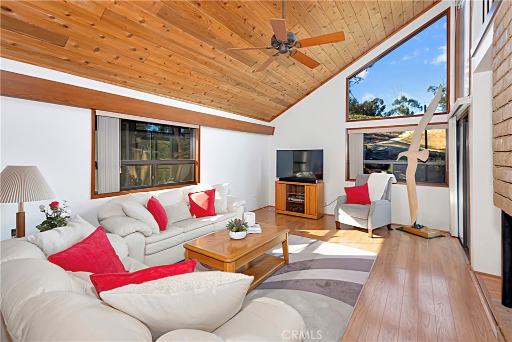 11879 Rocoso Road Lakeside, CA 92040 - Photo 8 of 25 a living room with furniture and a flat screen tv