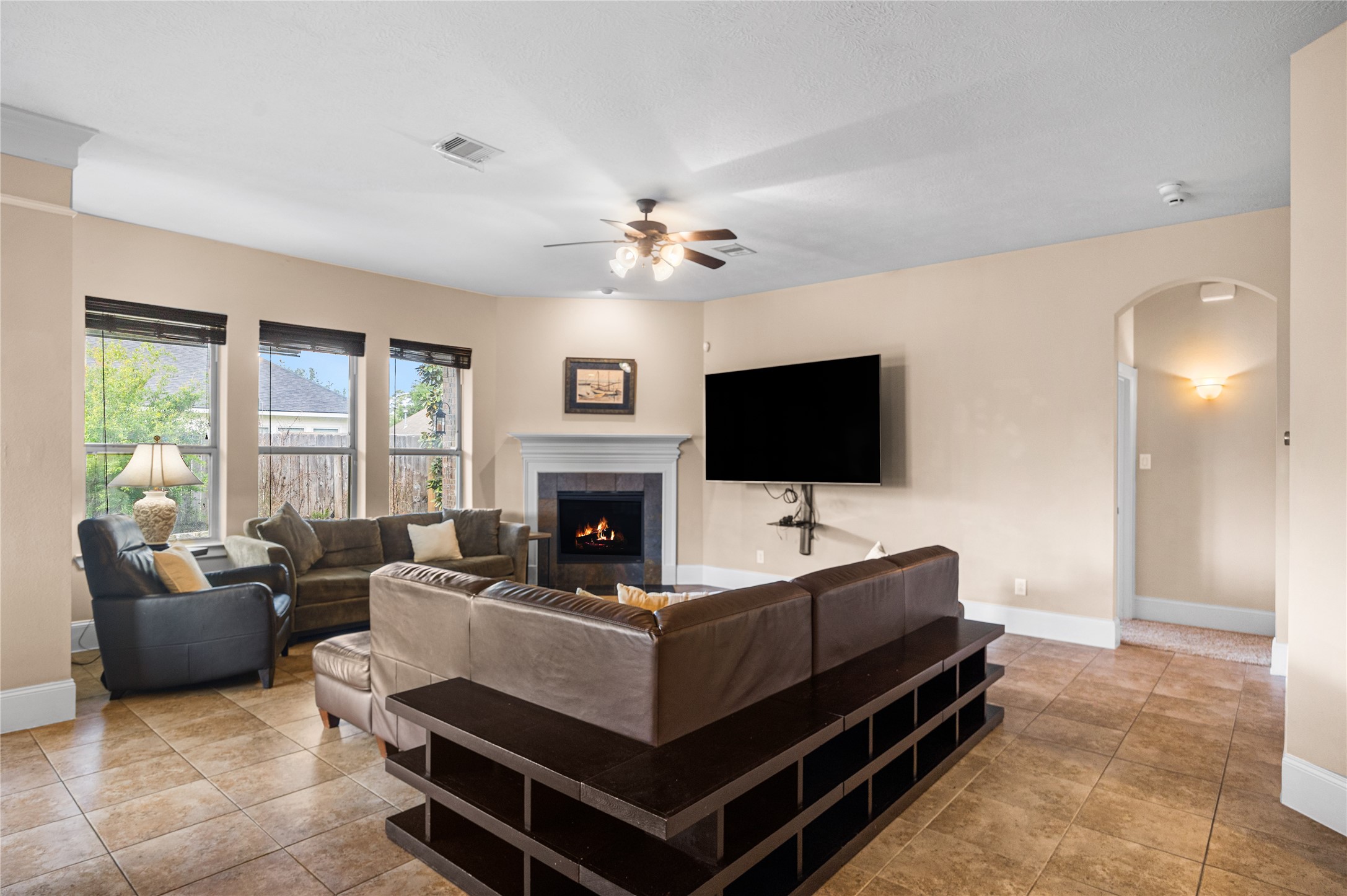 31311 Brighton Brook Lane Spring, TX 77386 - Photo 5 of 43 Expansive living room with a gas fireplace, creating a warm and inviting space.