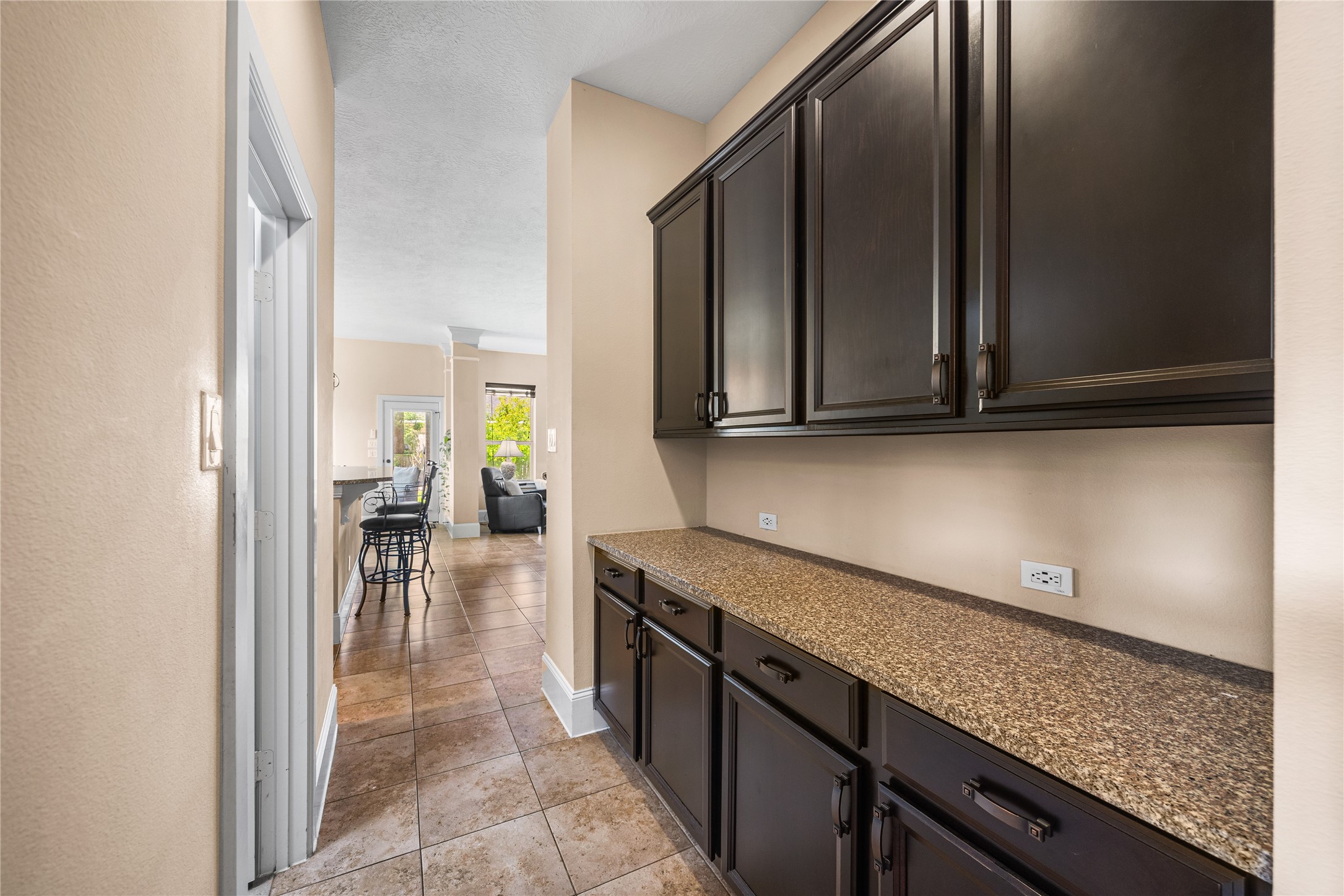 31311 Brighton Brook Lane Spring, TX 77386 - Photo 8 of 43 Functional butler’s pantry separating the dining room and kitchen, perfect for added prep and storage space.