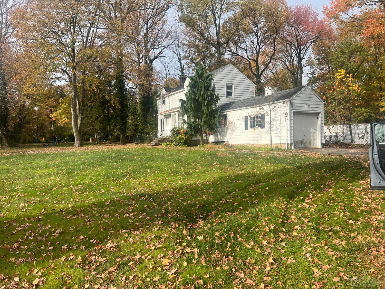 399 Middlesex Avenue Colonia, NJ 07067 - Photo 1 of 9 a brick house with trees in front of it