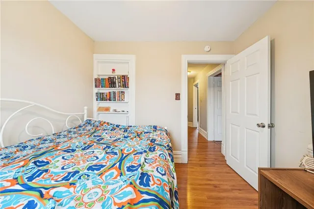 a spacious bathroom with a double vanity sink a large mirror and a shower