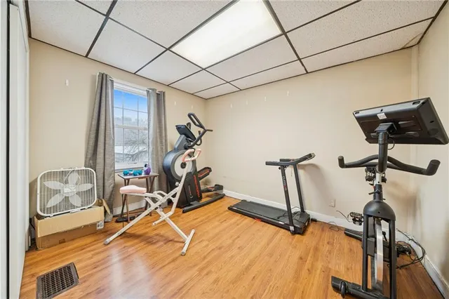 a bed room with a bed and a chandelier