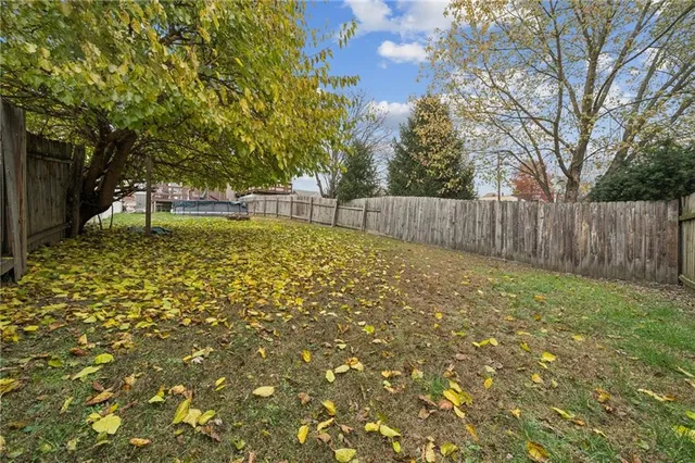 a view of a chairs and table in backyard