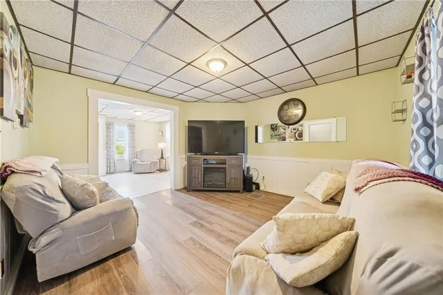 a bedroom with furniture and a flat screen tv