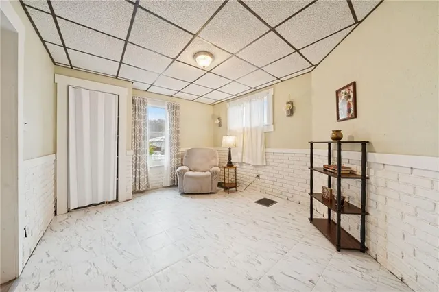 a bedroom with furniture and a wooden floor
