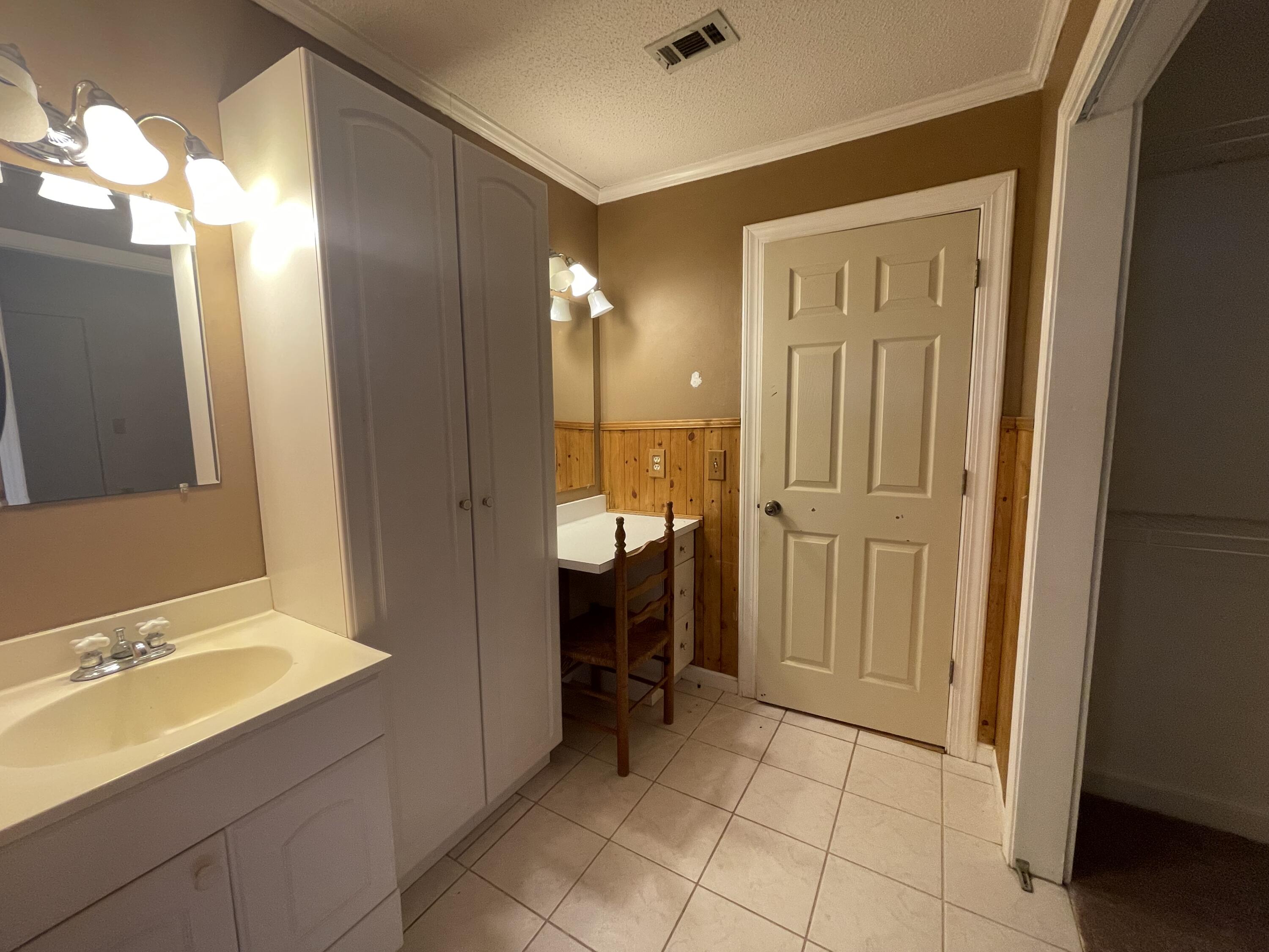 5341 Galiver Cutoff Baker, FL 32531 - Photo 8 of 13 a bathroom with a sink and a mirror