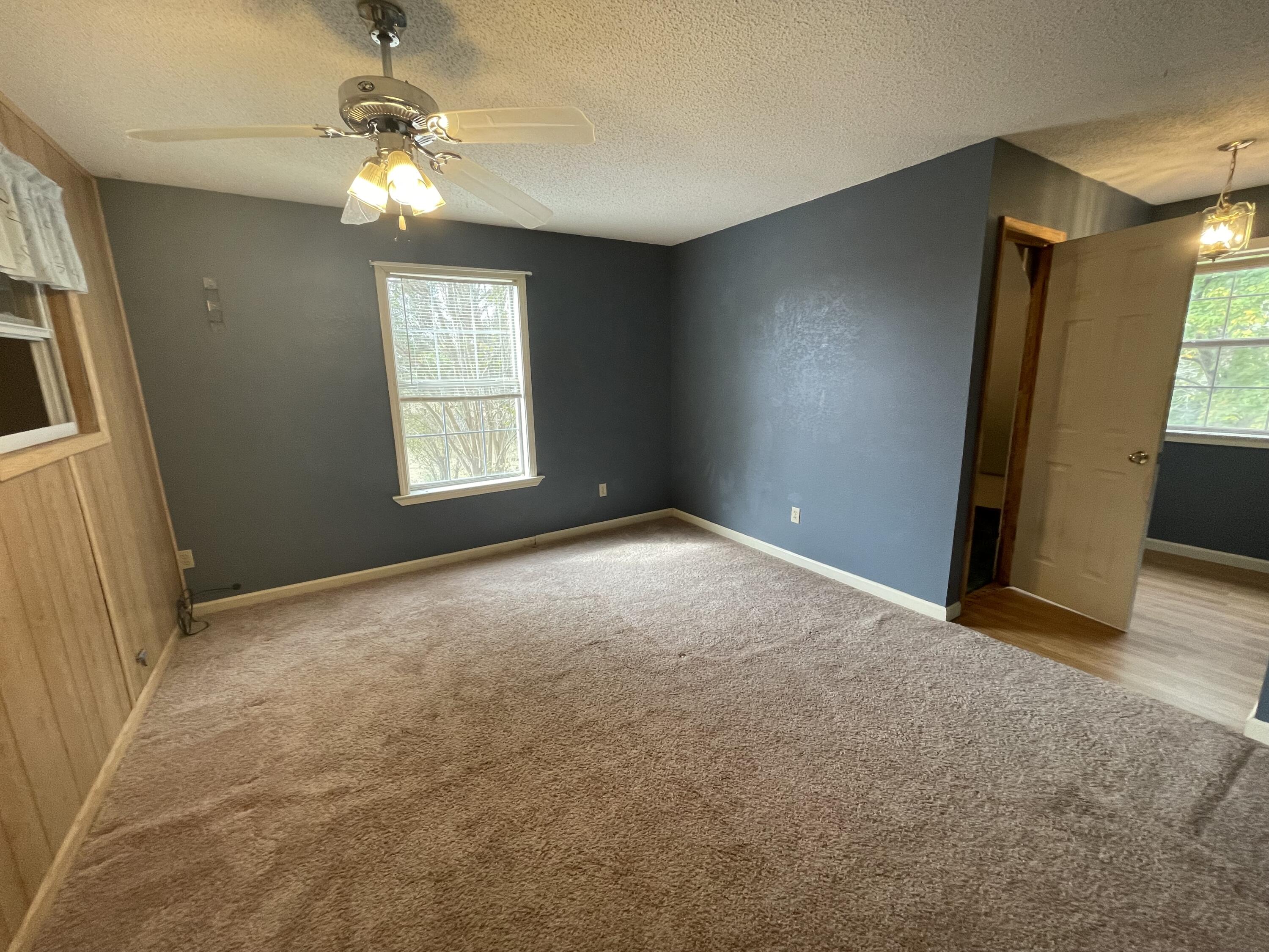 5341 Galiver Cutoff Baker, FL 32531 - Photo 9 of 13 an empty room with windows and fan