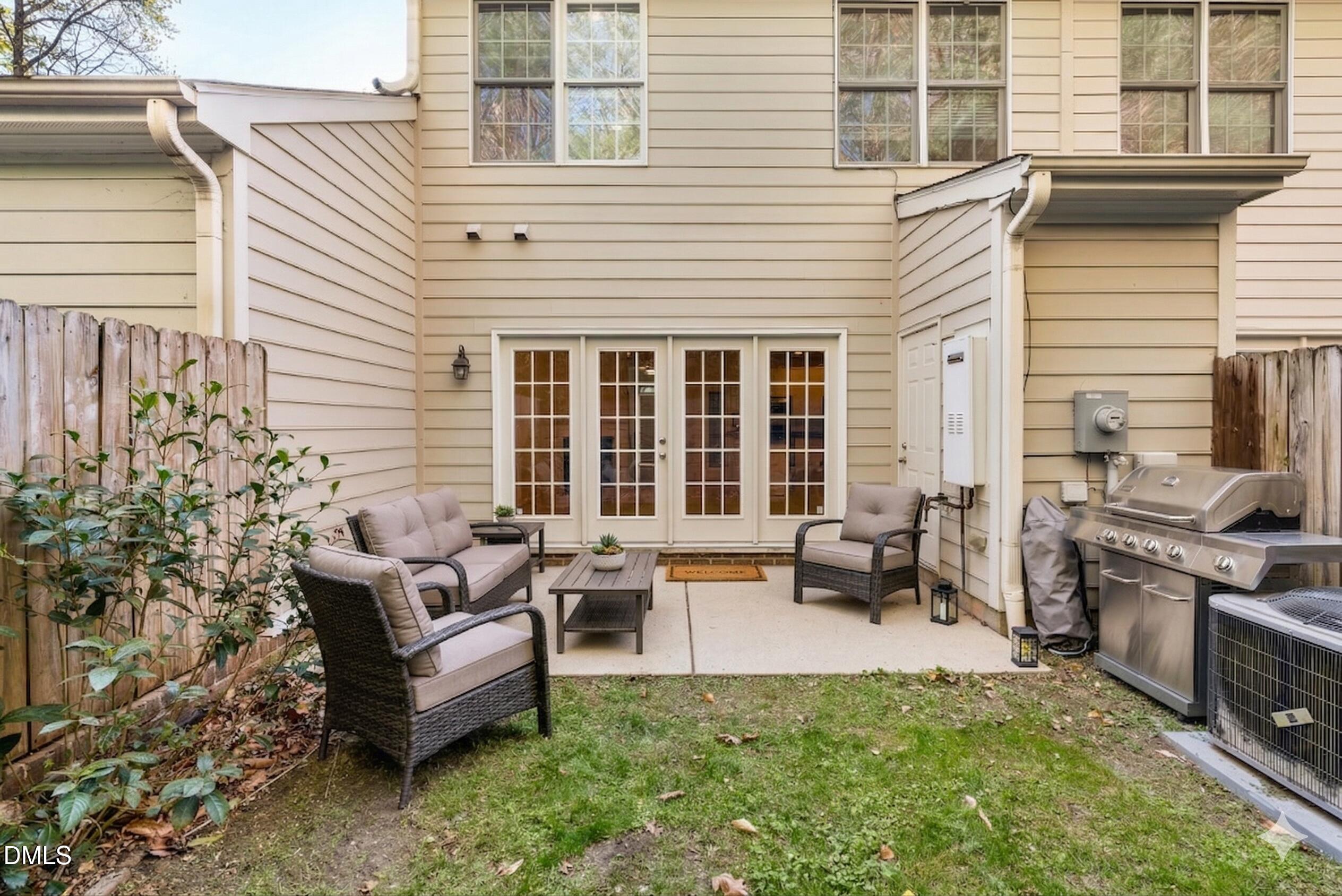2822 Pickett Road, Unit 154 Durham, NC 27705 - Photo 23 of 31 a view of a patio with couches chairs and a potted plant