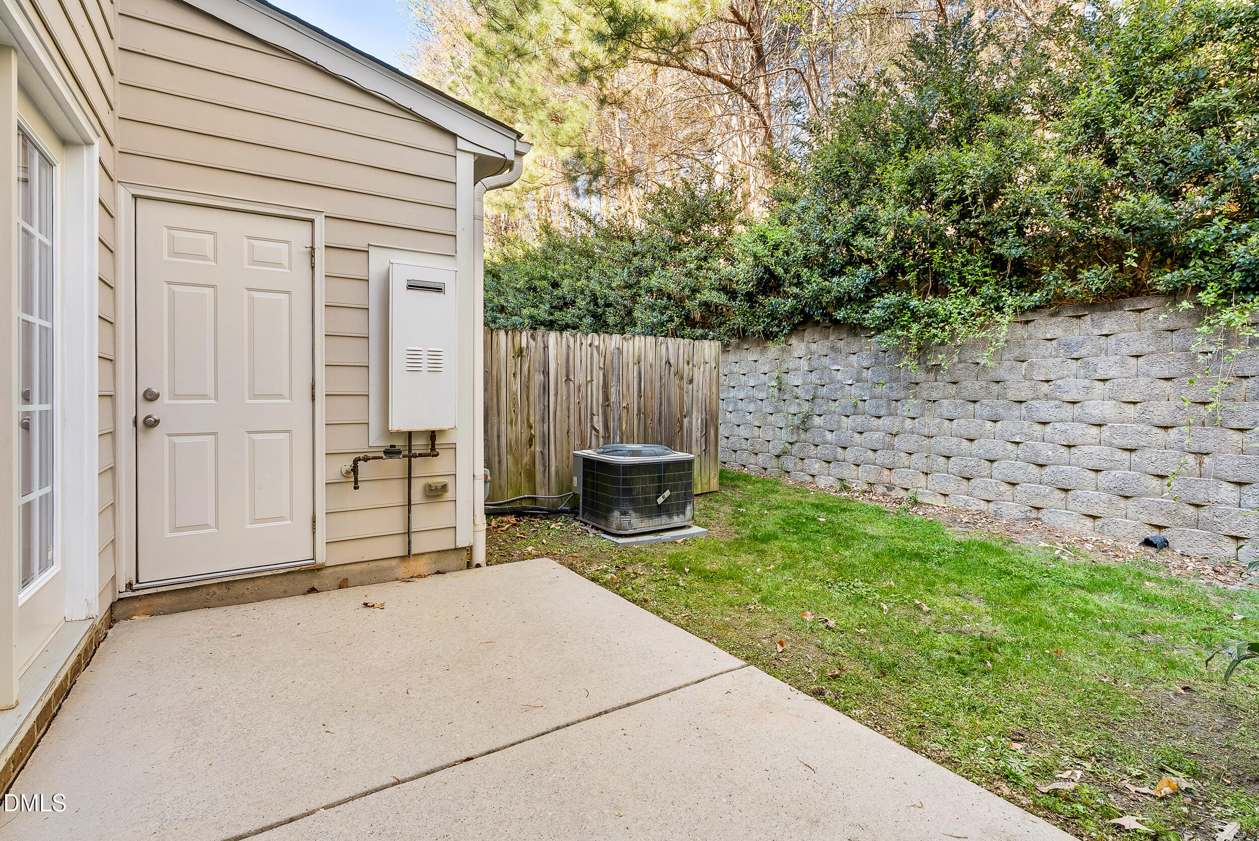 2822 Pickett Road, Unit 154 Durham, NC 27705 - Photo 25 of 31 a backyard of a house with lawn chairs and wooden fence