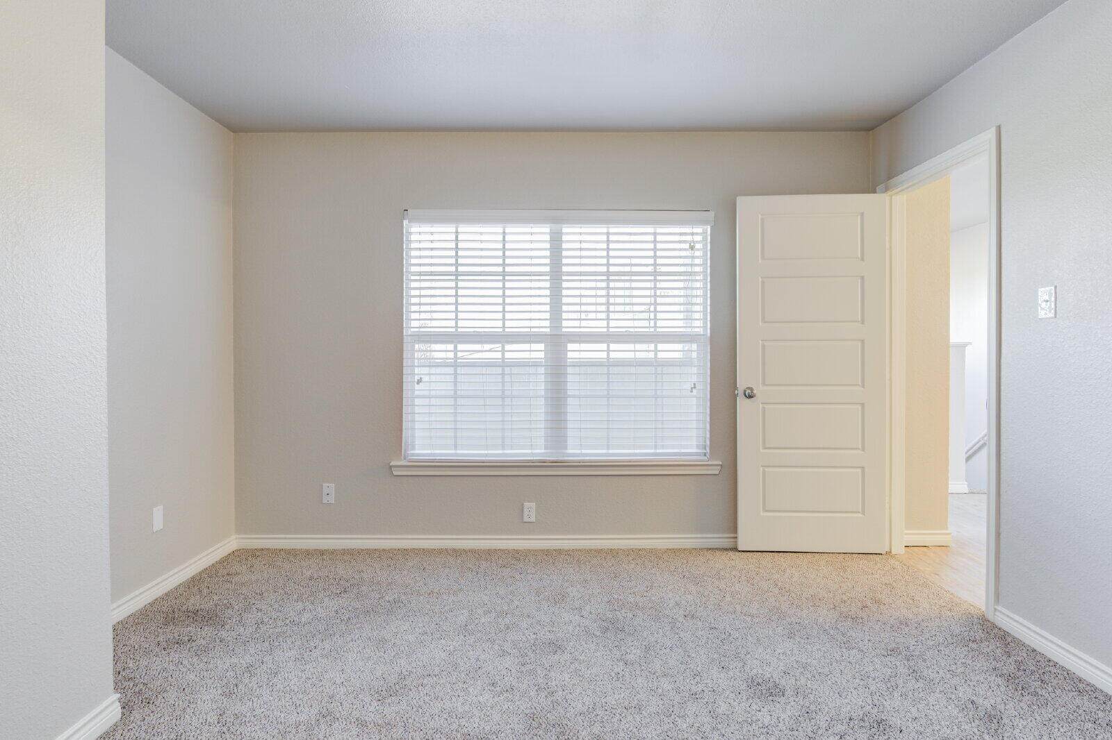 4320 52nd Street, Unit B Lubbock, TX 79413 - Photo 19 of 25 an empty room with a empty space and windows