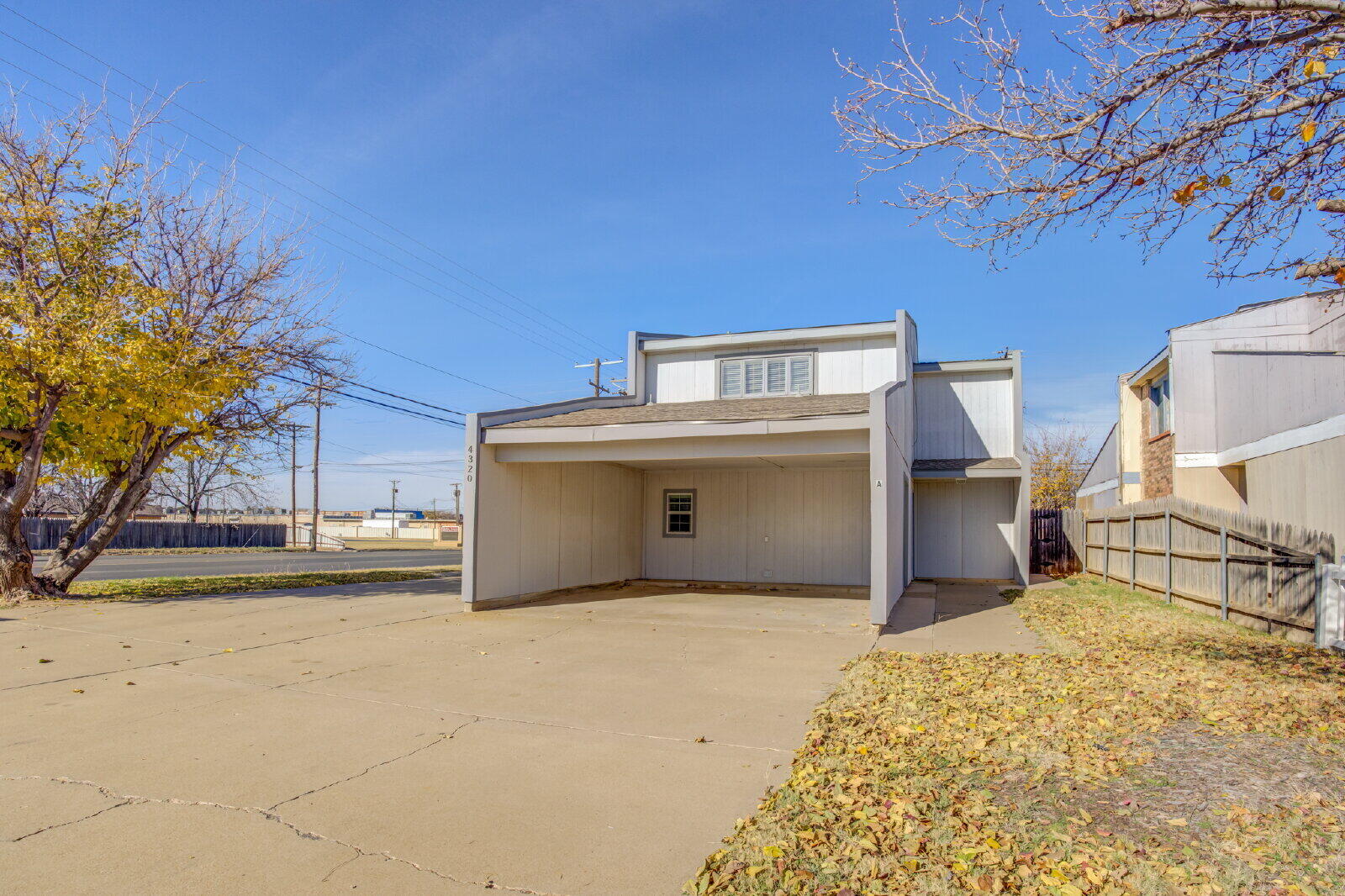 4320 52nd Street, Unit B Lubbock, TX 79413 - Photo 2 of 25 a view of a backyard of the house