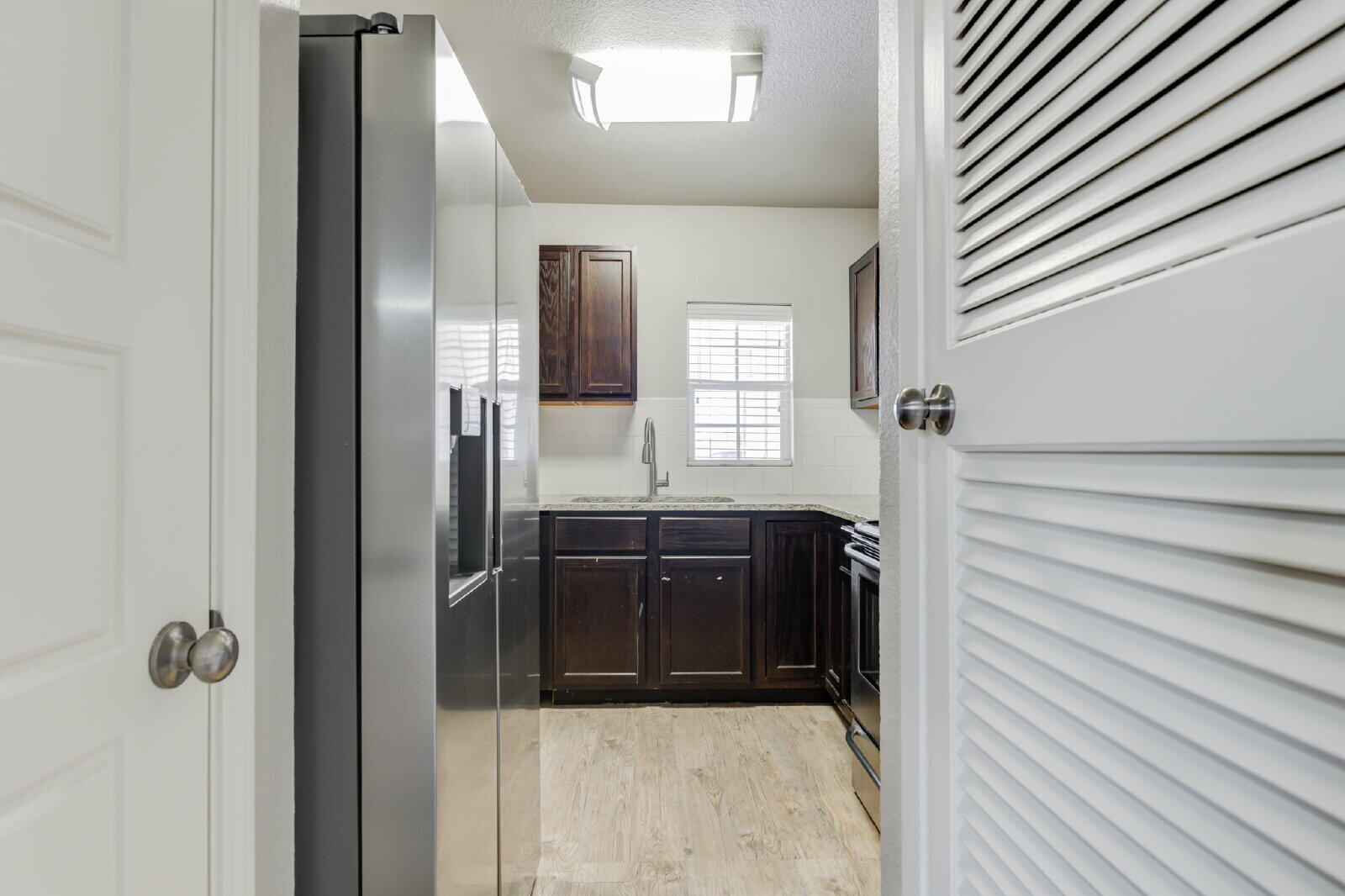 4320 52nd Street, Unit B Lubbock, TX 79413 - Photo 9 of 25 a bathroom with a bathtub and a shower