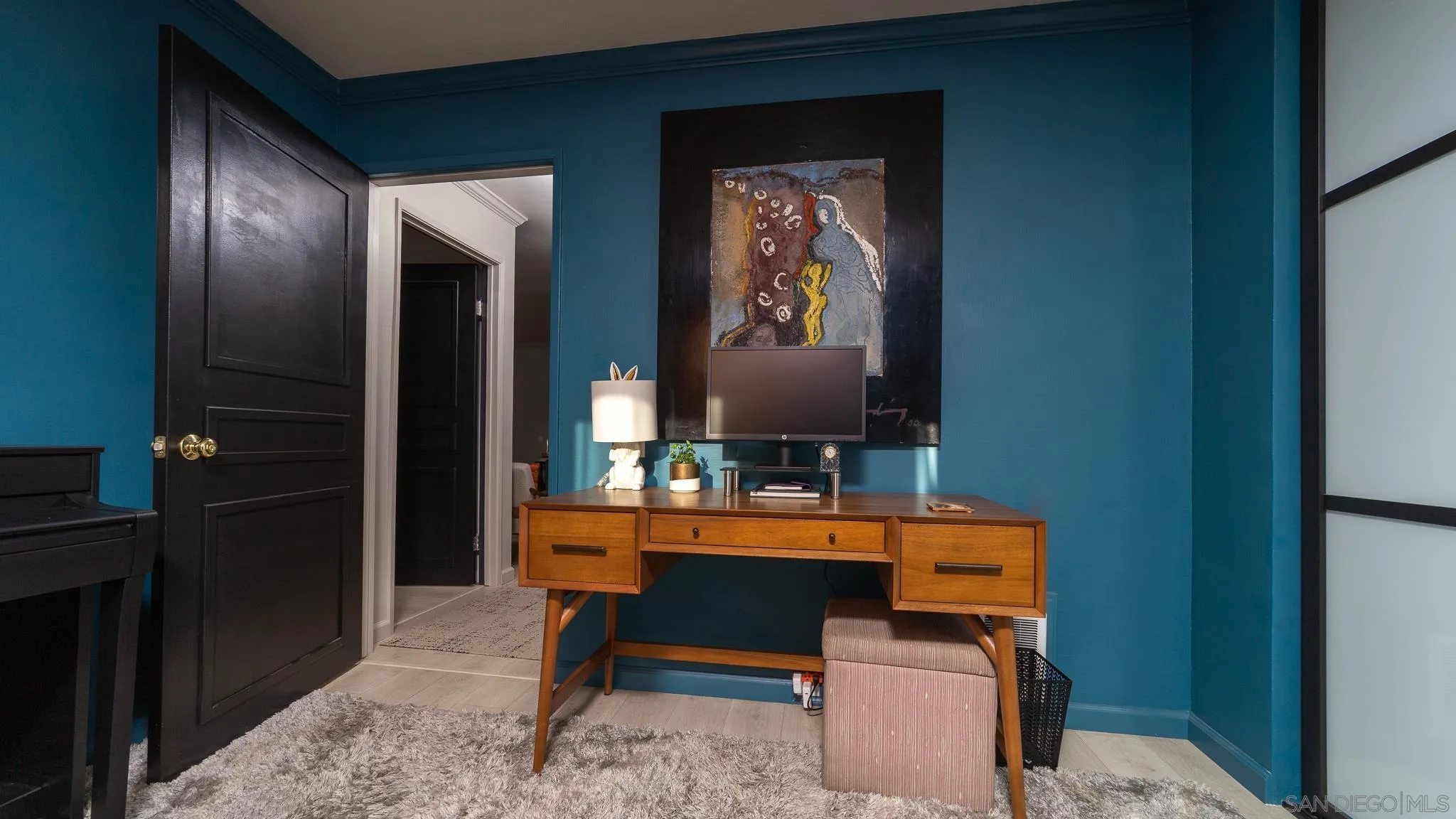 6358 Rancho Mission Road, Unit 624 San Diego, CA 92108 - Photo 11 of 23 a room with furniture and a mirror